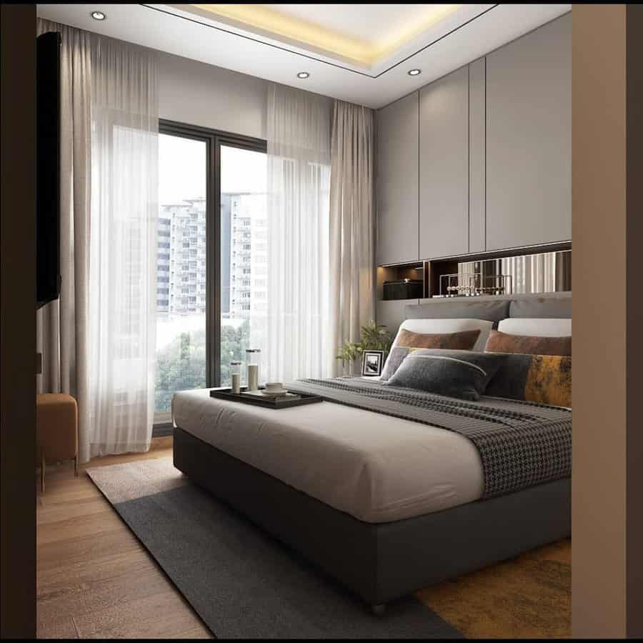 Chic bedroom with city view and plush bedding