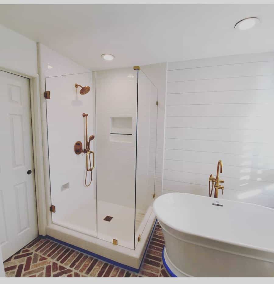 Bathroom shower with gold fixtures