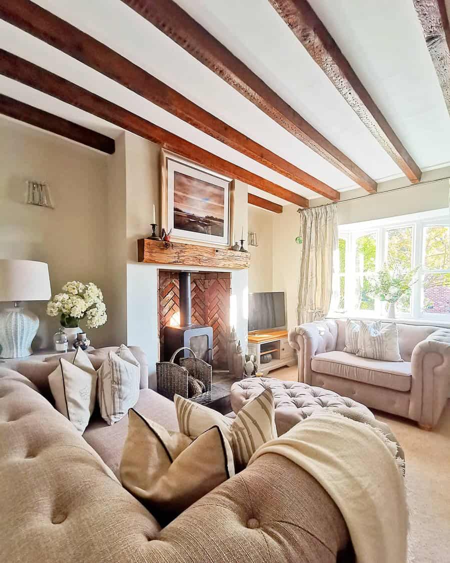 Elegant living room with exposed beams and plush sofas