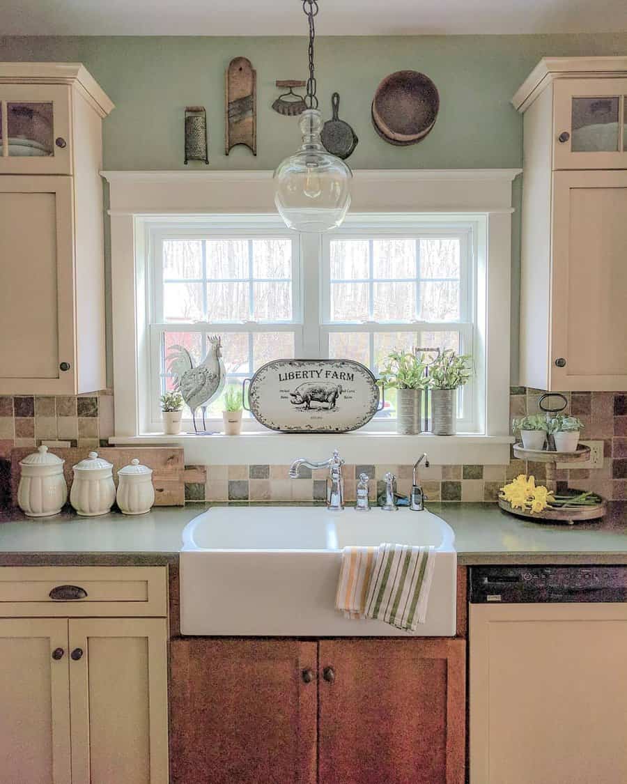 farmhouse kitchen with pastel sage green walls