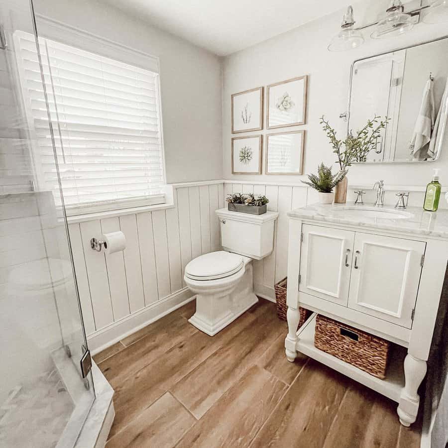 Bright bathroom with shower and botanical art