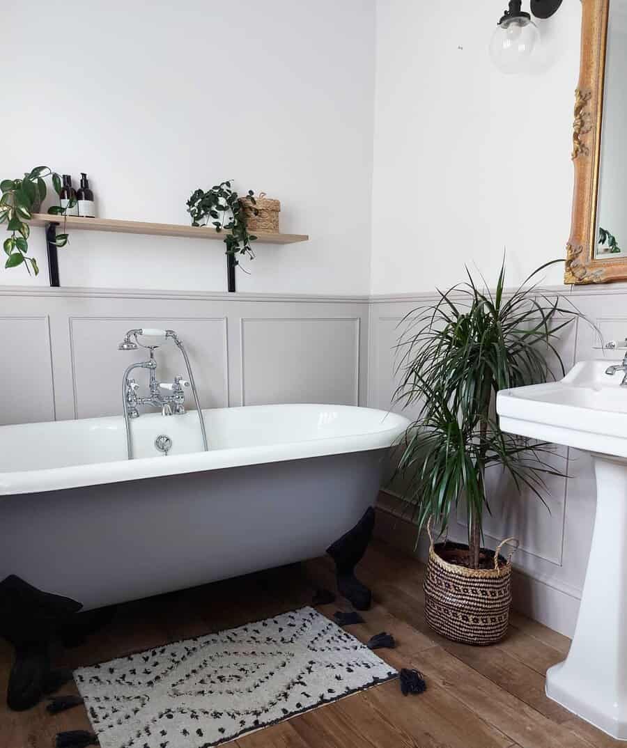 Chic bathroom with tub and potted plants