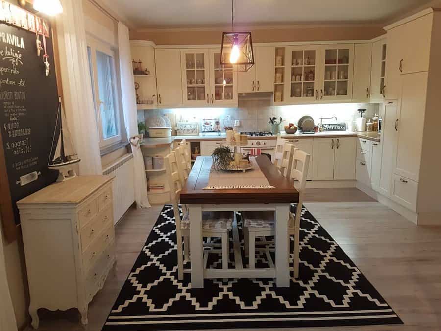 White kitchen with area rug