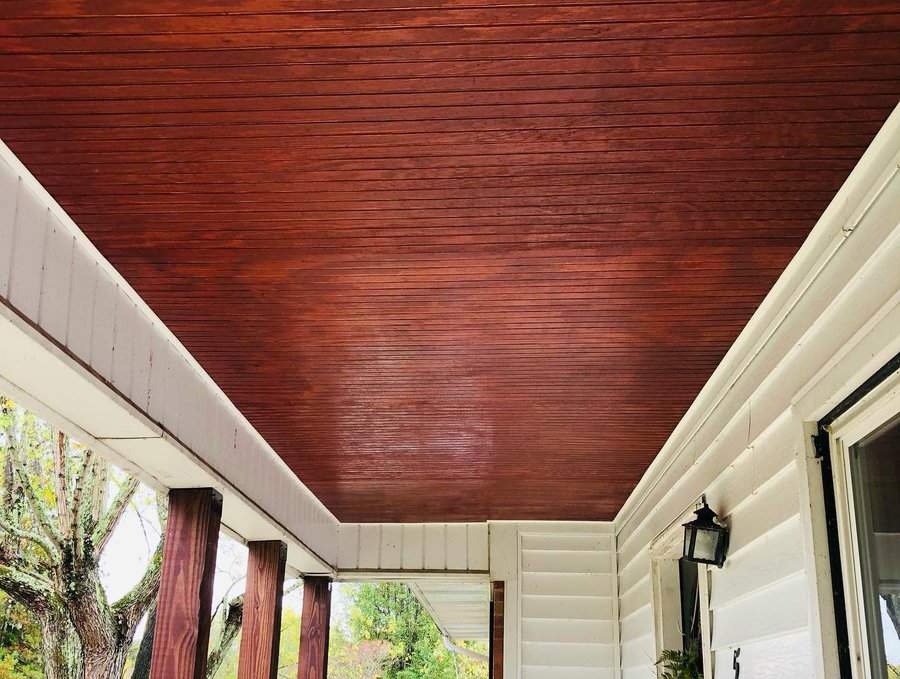 Dark wood porch ceiling 