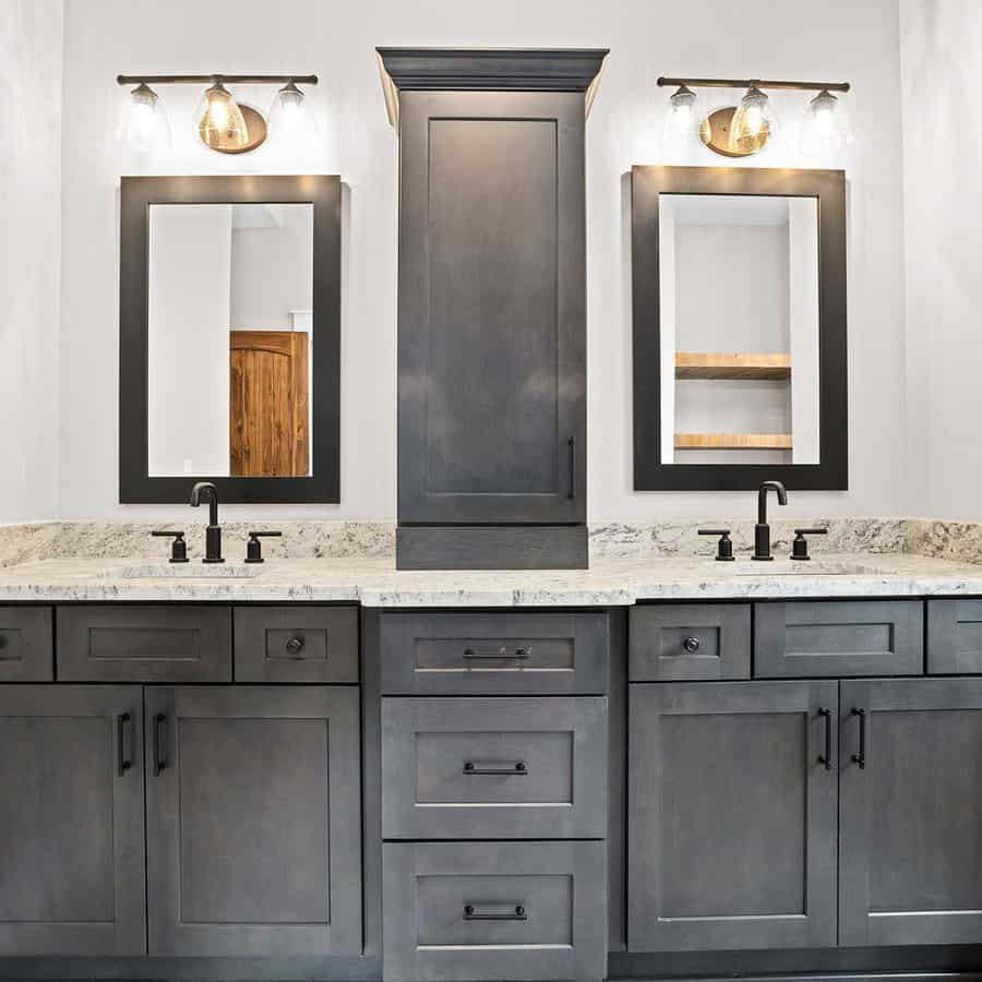 Double vanity with mirrors and sconces in gray bathroom