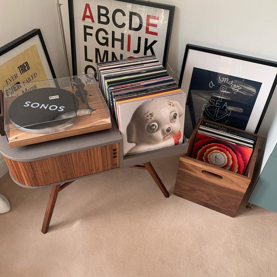 Modern turntable with stacked vinyls and art