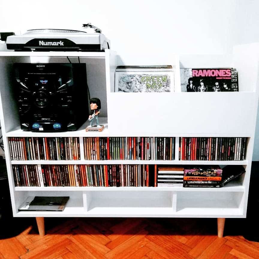 Modern turntable and CD shelf with band art