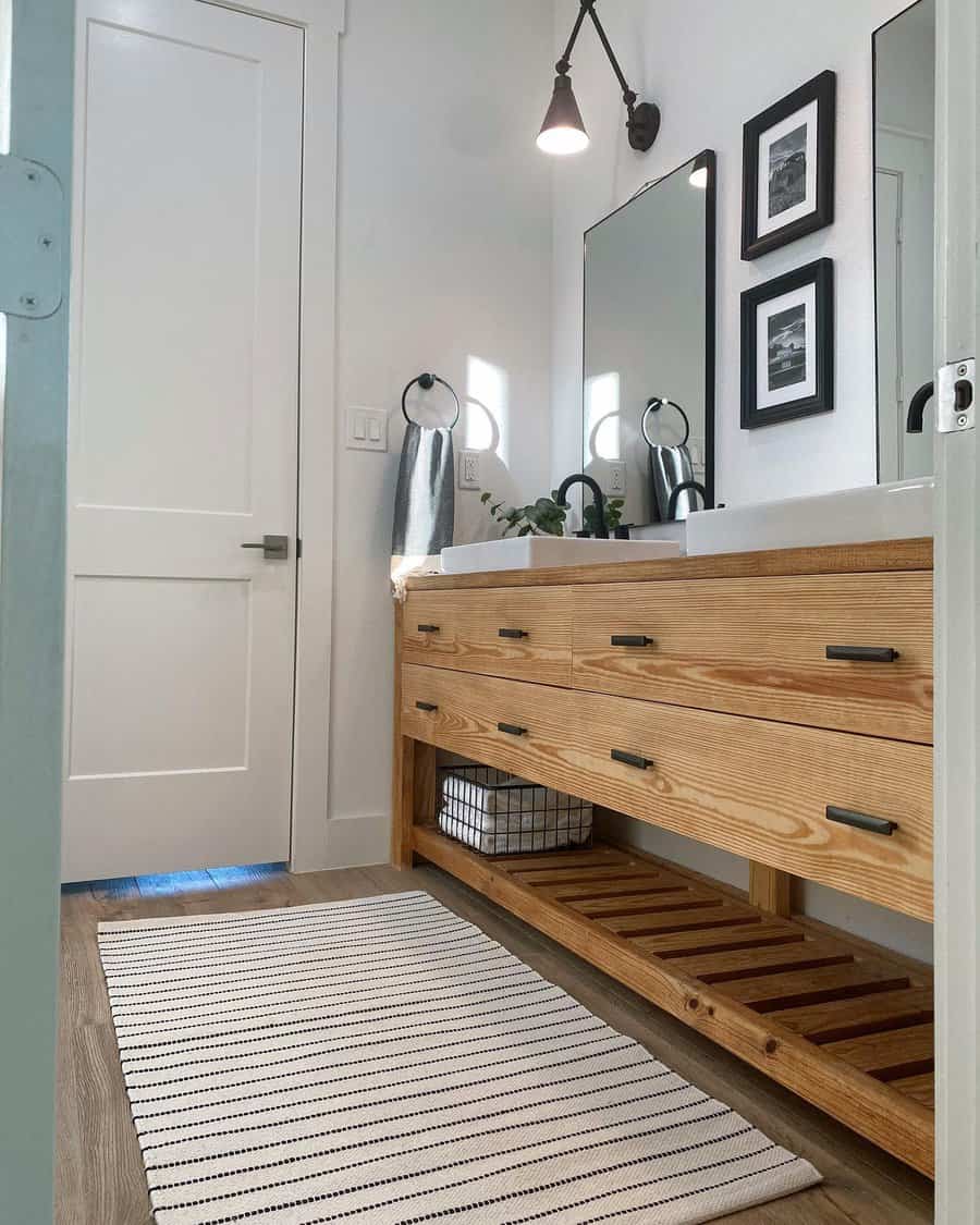 Modern bathroom with wooden vanity and mirrors