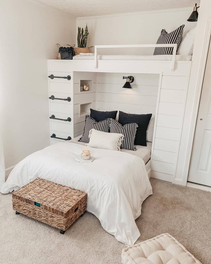 Stylish white bunk bed with built-in shelves and industrial ladder, paired with cozy bedding and black-and-white accents