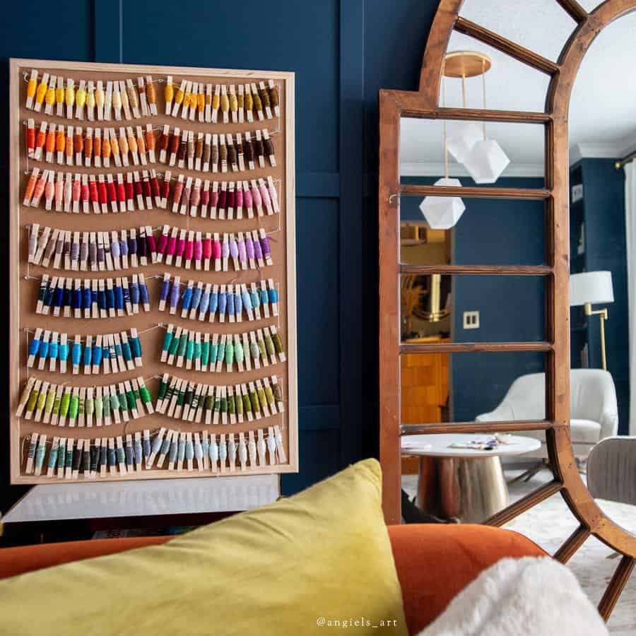 Thread spools on board in cozy interior with mirror