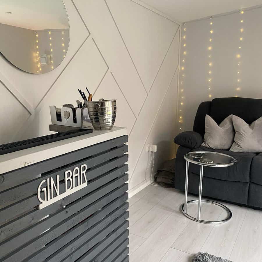 Attic home bar with cozy seating and warm fairy lights