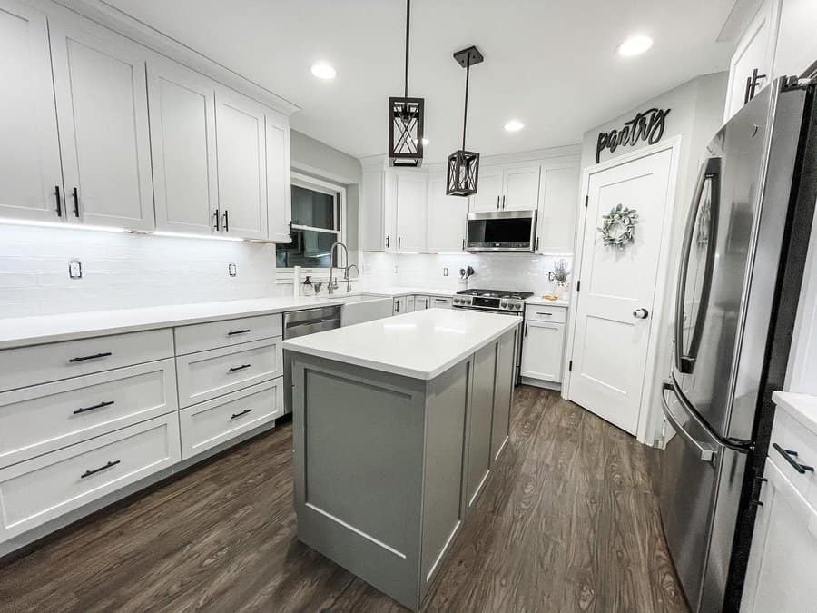 Stylish kitchen with island and white subway tiles