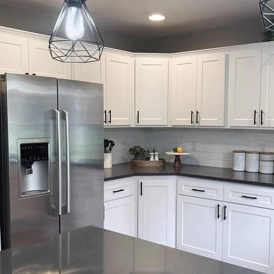 White cabinets with black countertops