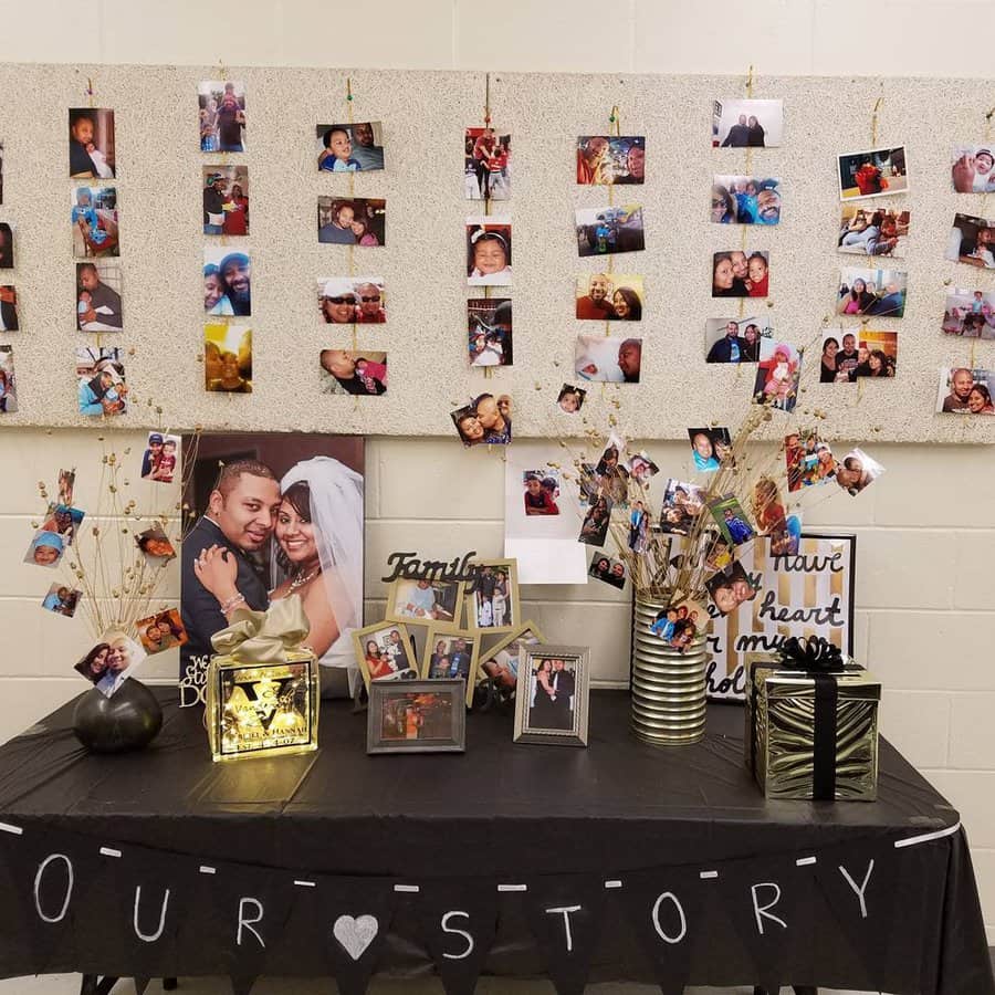 A display of family photos on a wall and table, with vases and decorations