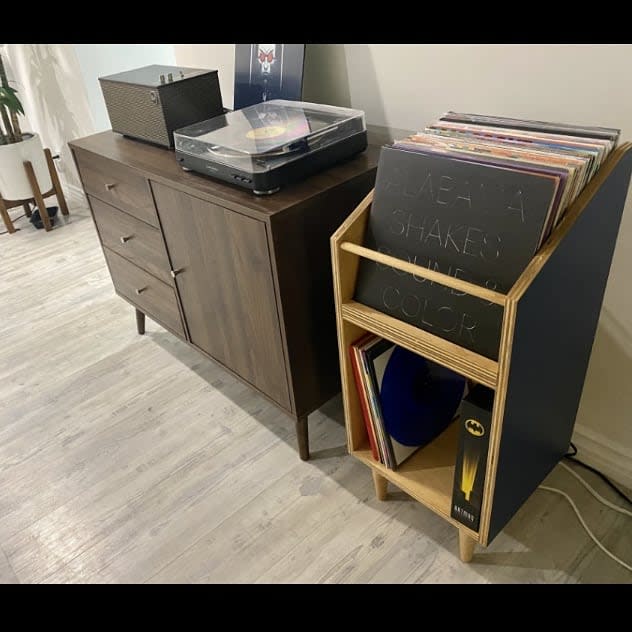 Sleek vinyl setup with record player and storage