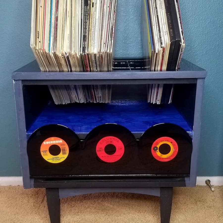 Vintage blue cabinet repurposed for vinyl storage