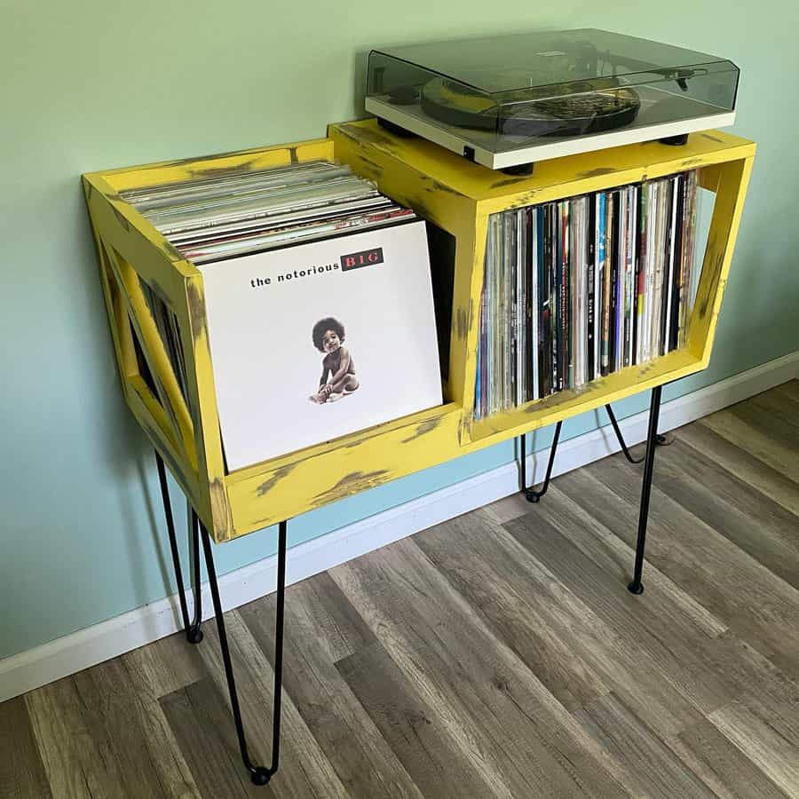 Bold yellow record stand with vinyls and turntable