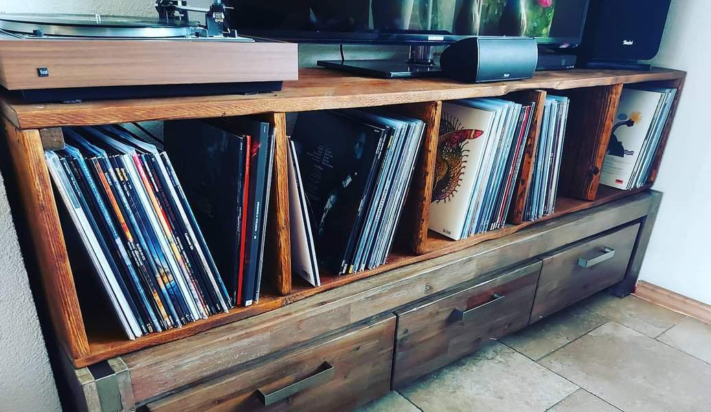 Rustic cabinet with record player and vinyl collection