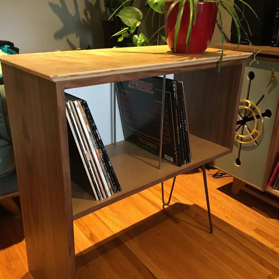 Modern wooden table with vinyl record storage