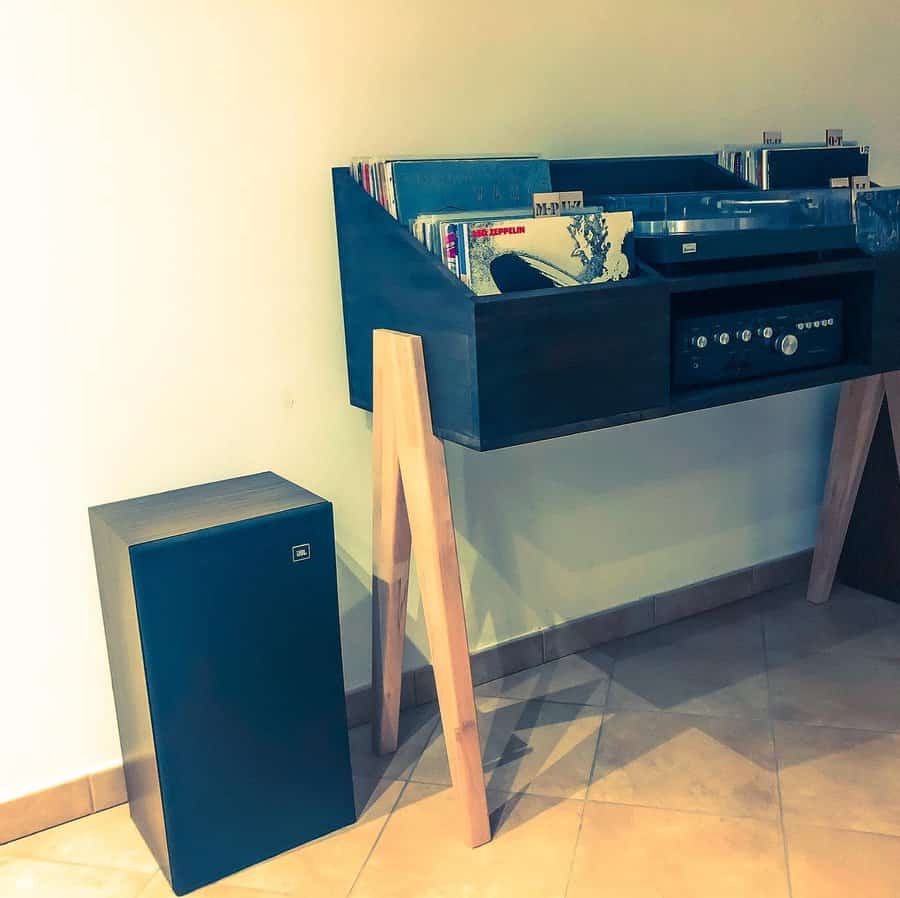 Modern vinyl player stand with sleek speaker