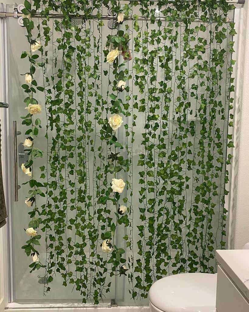 Glass shower door with faux trailing plants