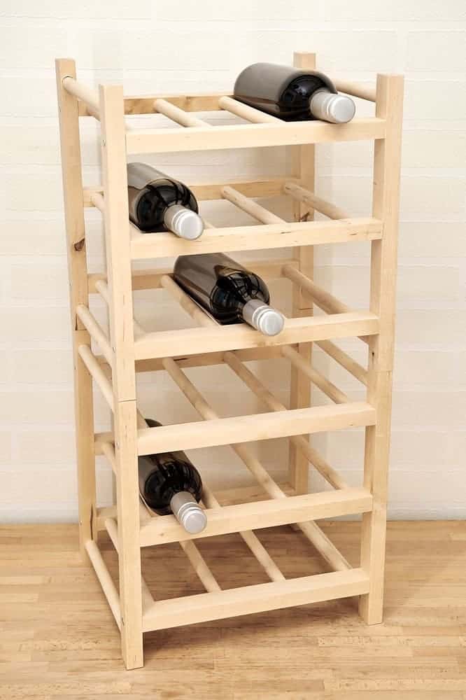 Wooden wine rack with six horizontal shelves, each holding a single wine bottle