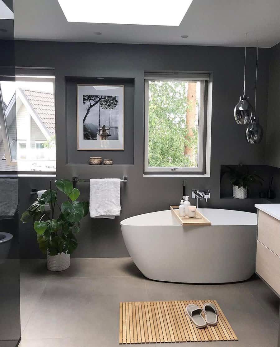 Spacious gray bathroom with freestanding tub