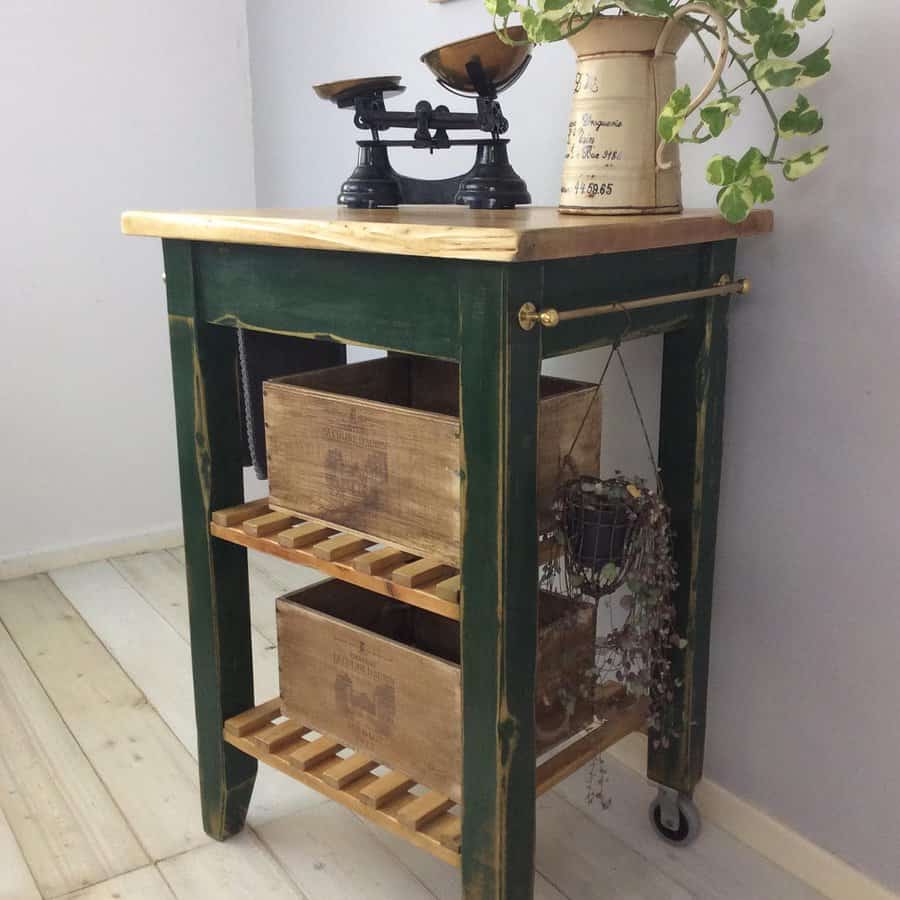 Vintage green kitchen trolley with scales and plant