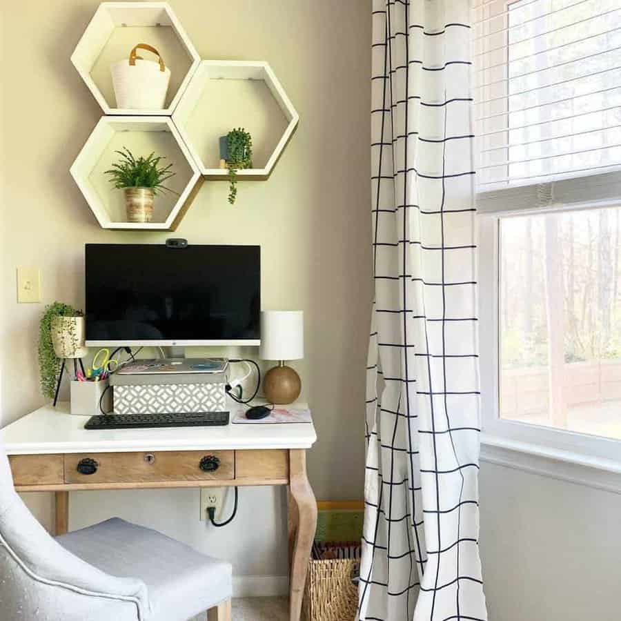 Hexagon floating shelves with plants and decor add a stylish touch above a rustic desk in a cozy, well-lit home office