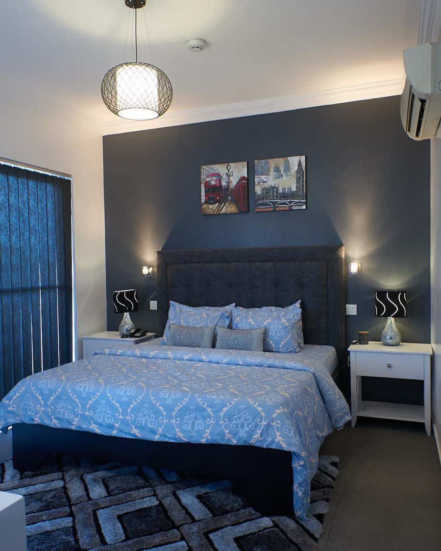 Modern bedroom with grey walls and blue bedding