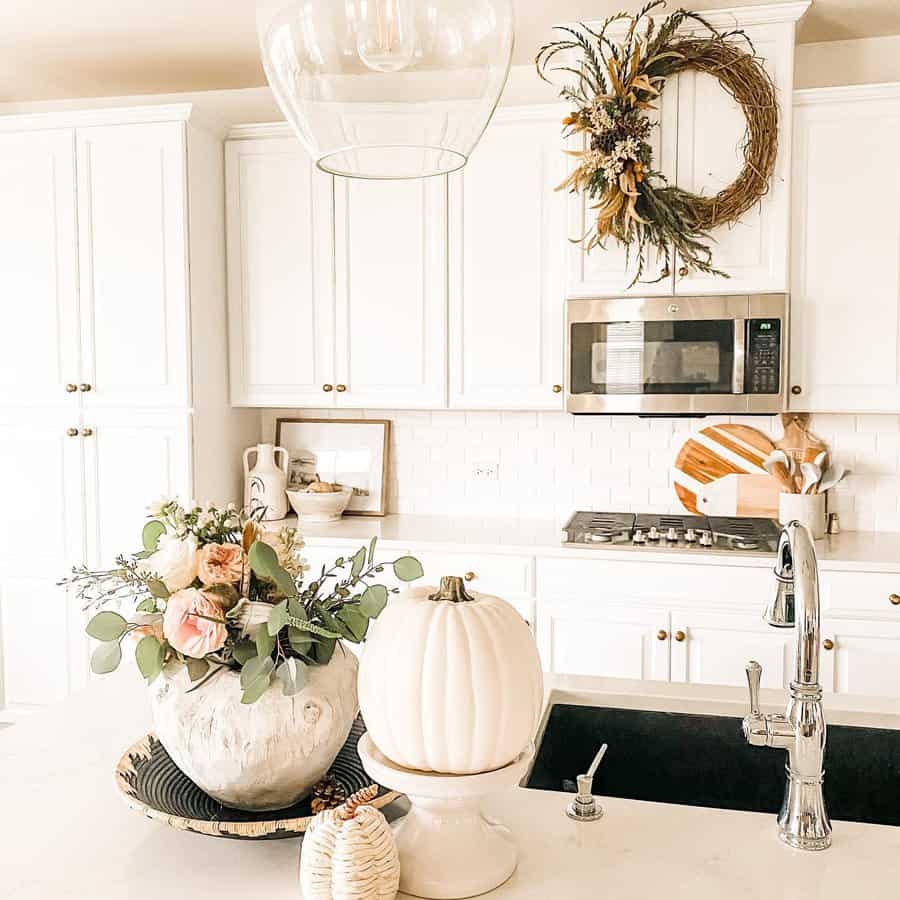 White kitchen with gold fixtures 