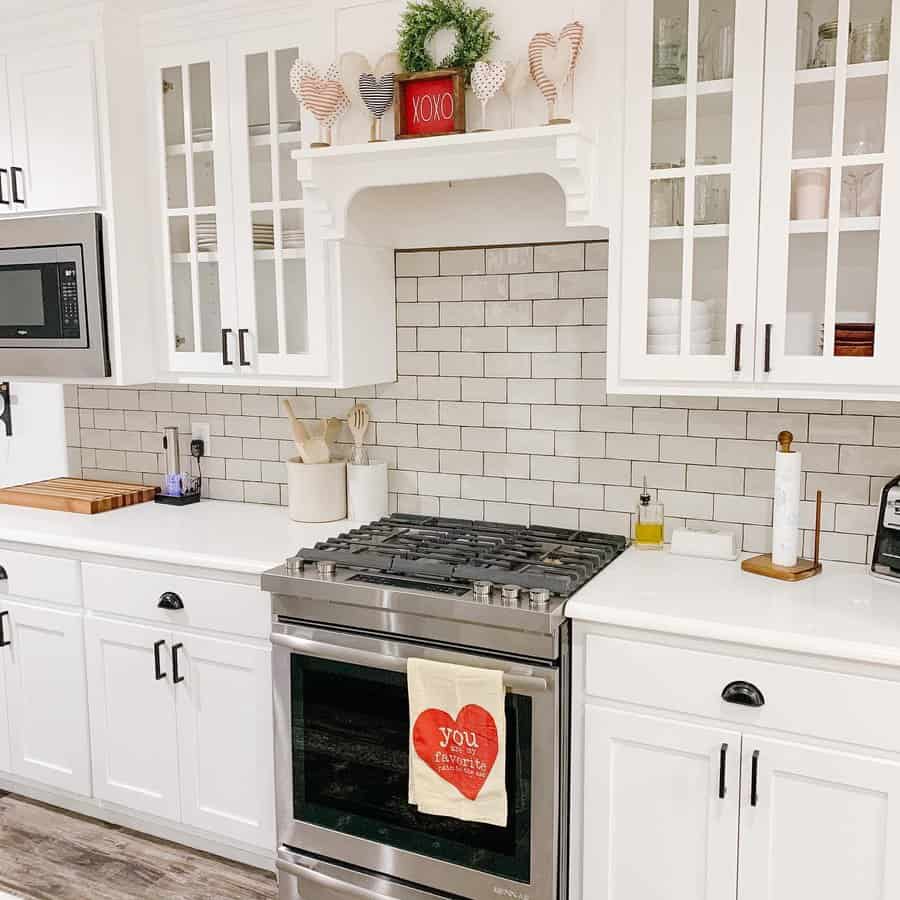 white kitchen with white beveled tiles