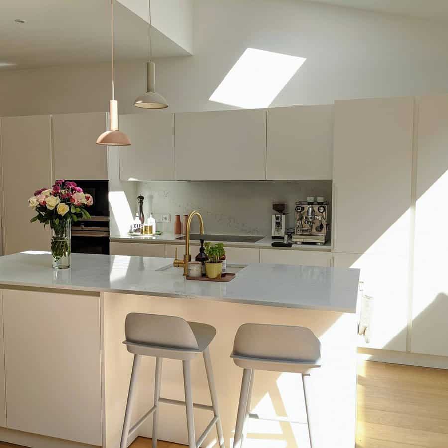 White kitchen with gold fixtures 