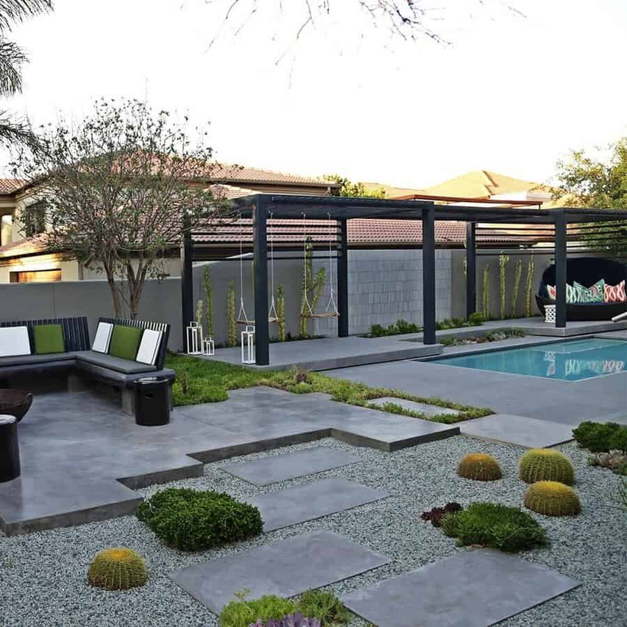 Pebbles and concrete pavers pool landscape