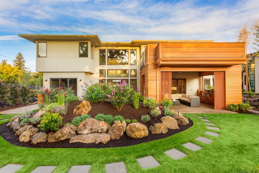 Modern home with rock garden and stepping stones