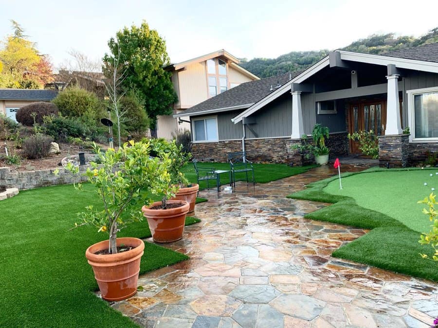 Home entry with flagstone walkway and seating area