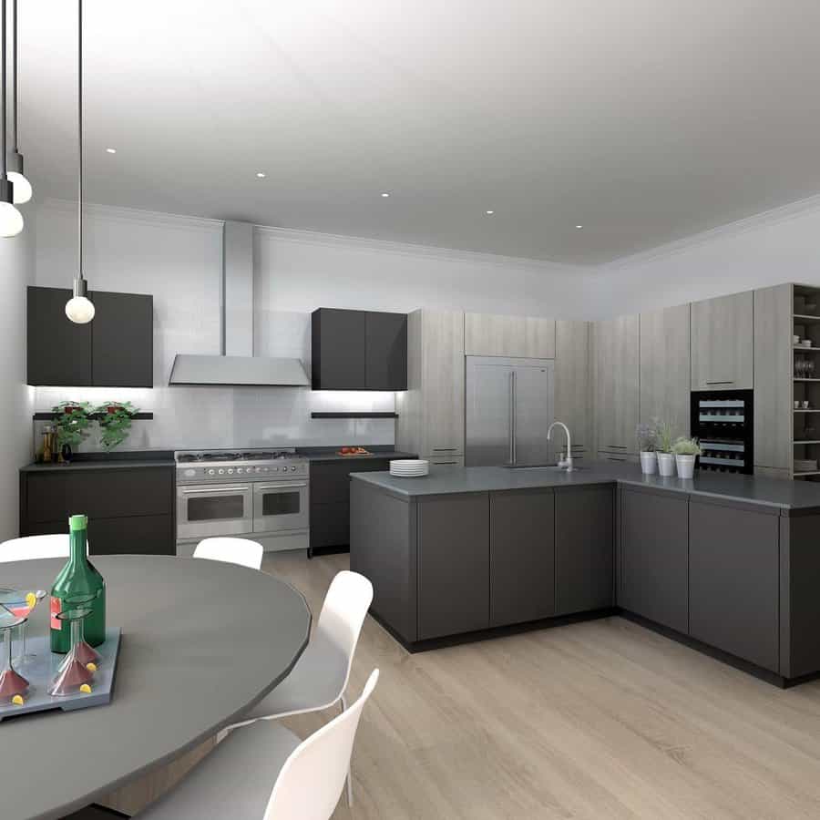 Modern kitchen with grey cabinets, island, stainless steel appliances, and dining table