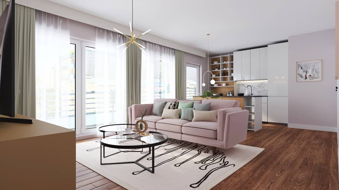 Modern living room with a pink sofa, glass coffee table, floor-to-ceiling windows, hardwood floors, and an open kitchen with bar stools