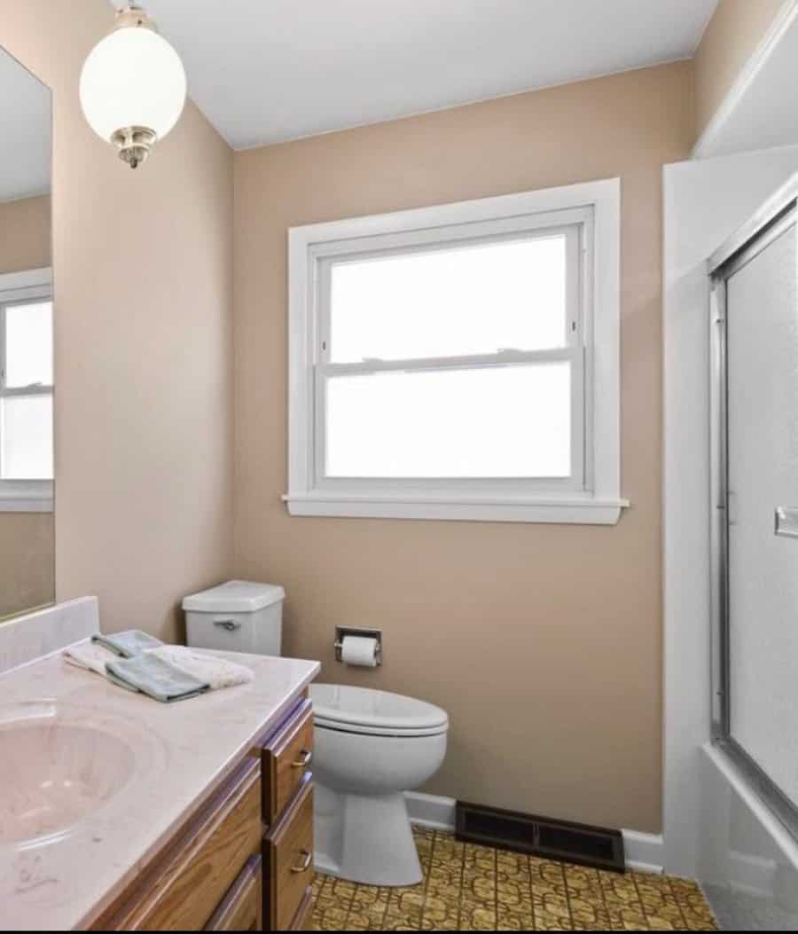 small bathroom with frosted glass window