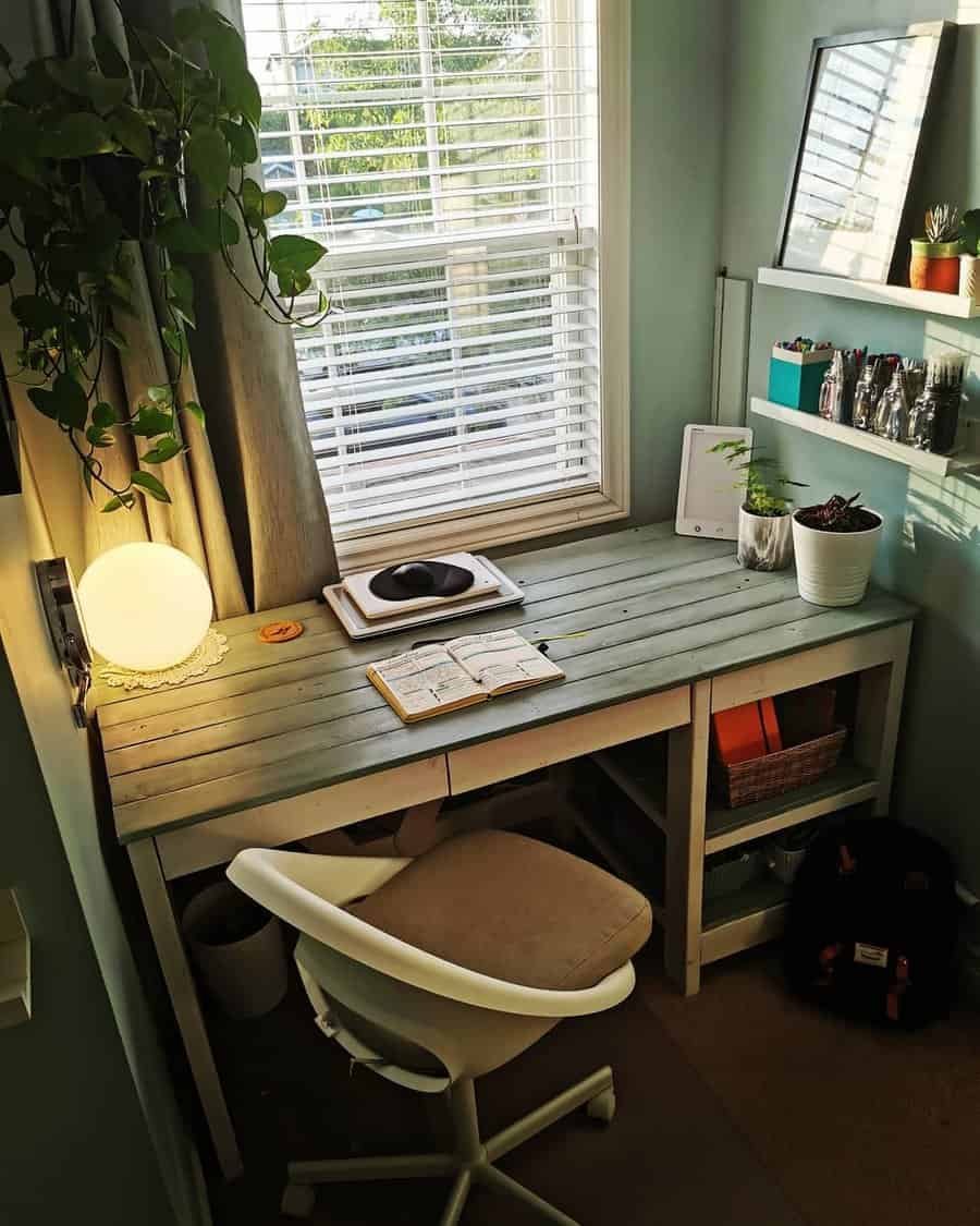 Cozy corner desk with natural light and greenery