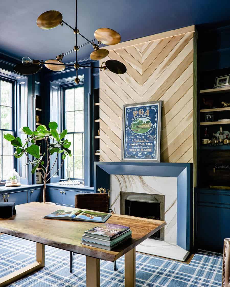 Office with blue walls and chevron shiplap fireplace