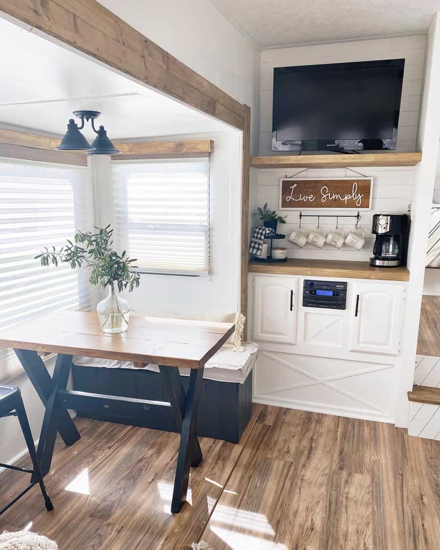 Bright RV dining space with wooden table