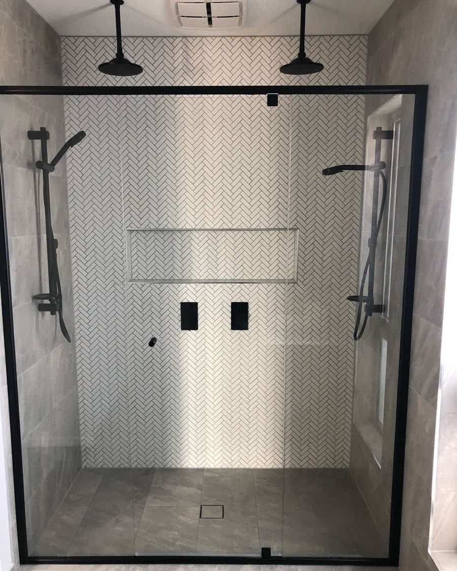 bathroom shower with herringbone tiles