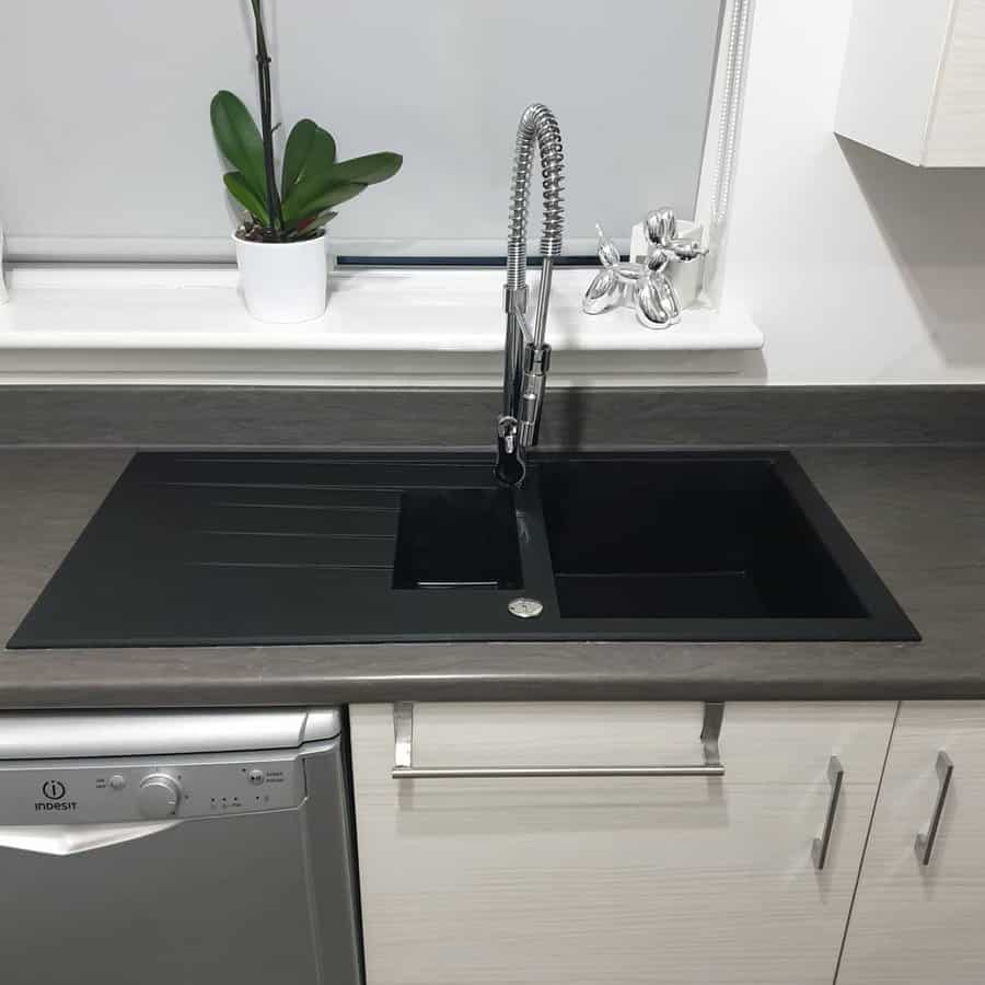 Modern kitchen with sleek black sink and sprayer