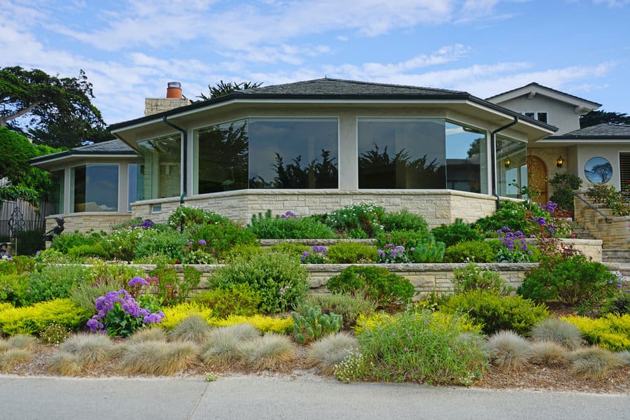 House with tiered garden and drought-tolerant plants