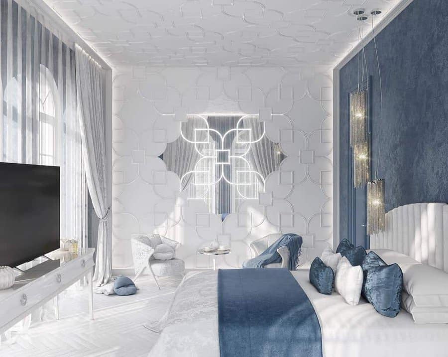 blue bedroom with mirrors