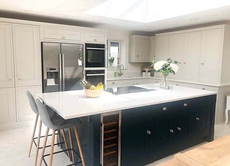 Elegant kitchen with beige cabinetry and a contrasting island