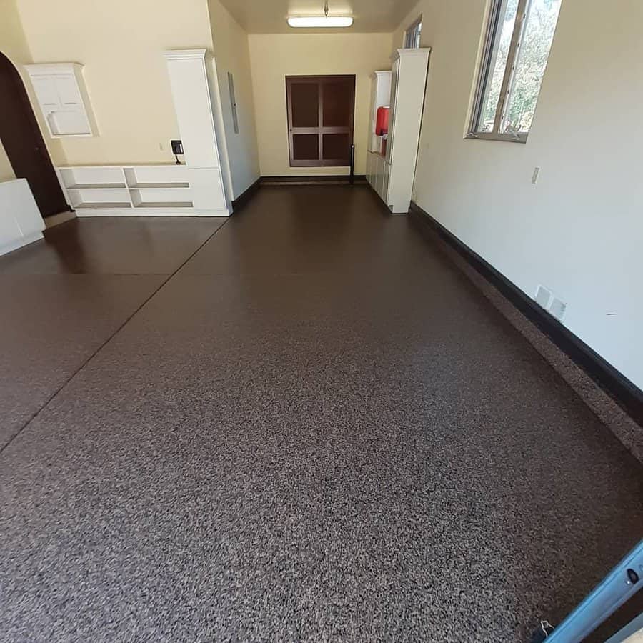 garage with brown floor and beige wall 