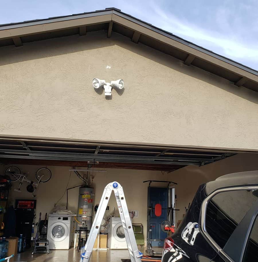 Garage exterior with dual security lights above door