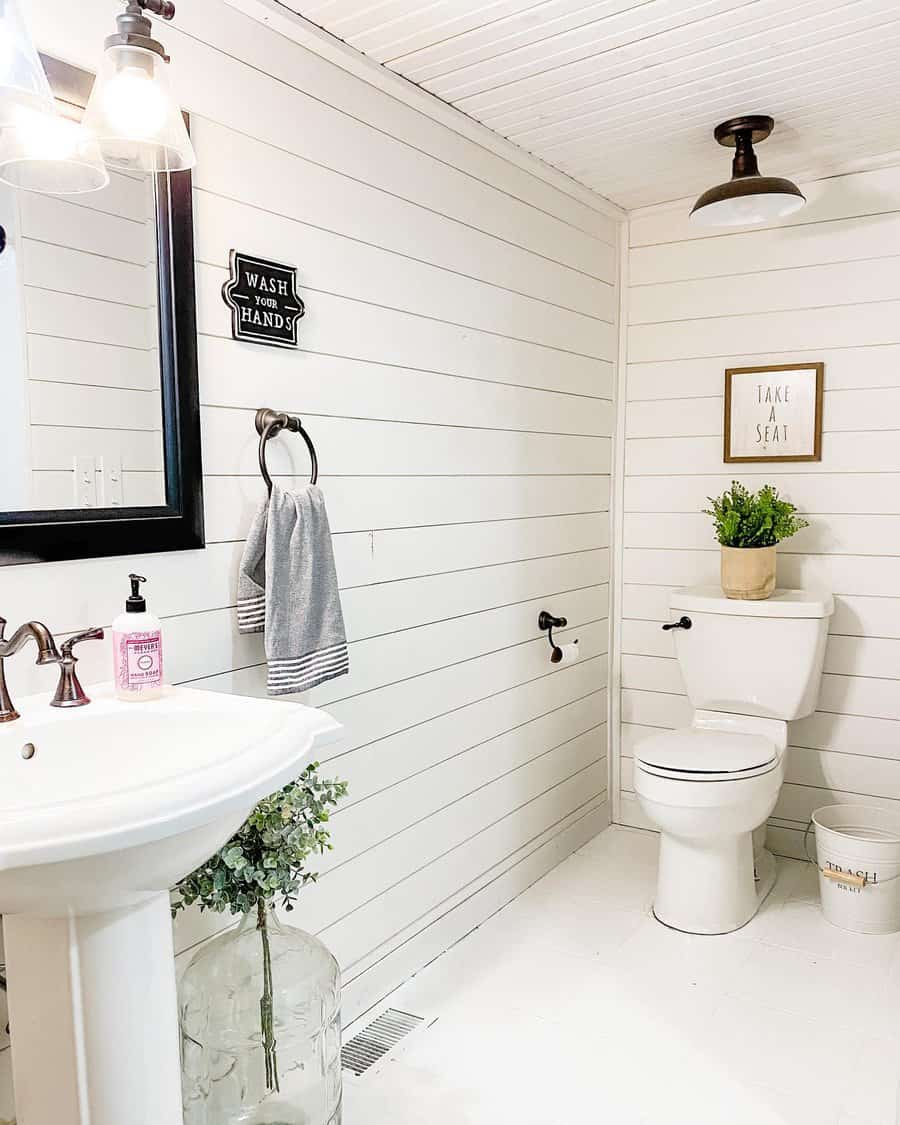 Basement bathroom with white cladded walls